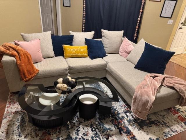 a living room with a couch and a coffee table at Home in Moore Serenity Oasis! relax in style! in Moore