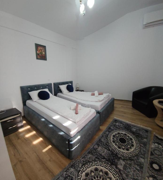 Postel nebo postele na pokoji v ubytování PENSIUNEA CAMELIA