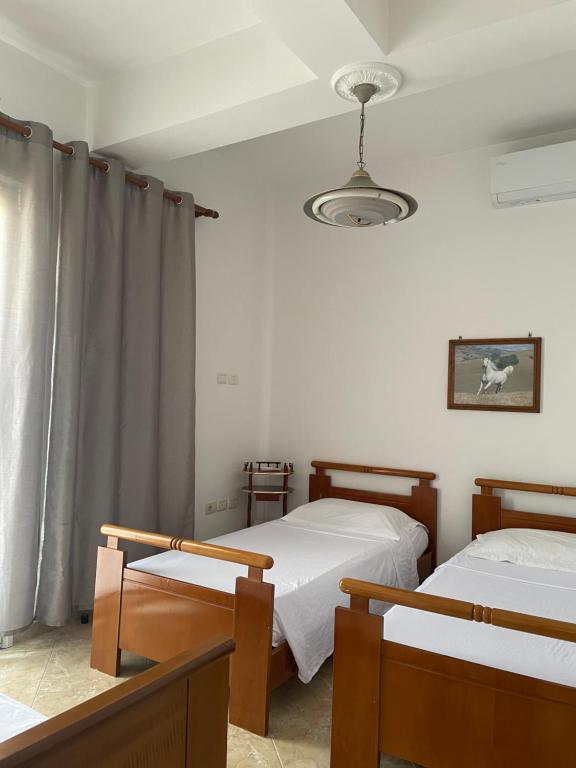 Postel nebo postele na pokoji v ubytování Guest House Irvin