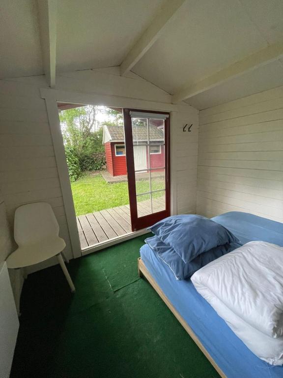 Postel nebo postele na pokoji v ubytování Camping de Heemtuin