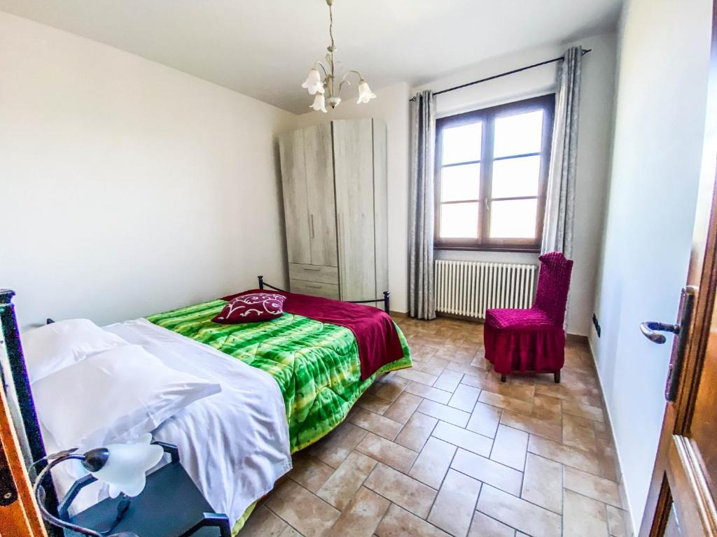 A bed or beds in a room at Agriturismo Il Falco