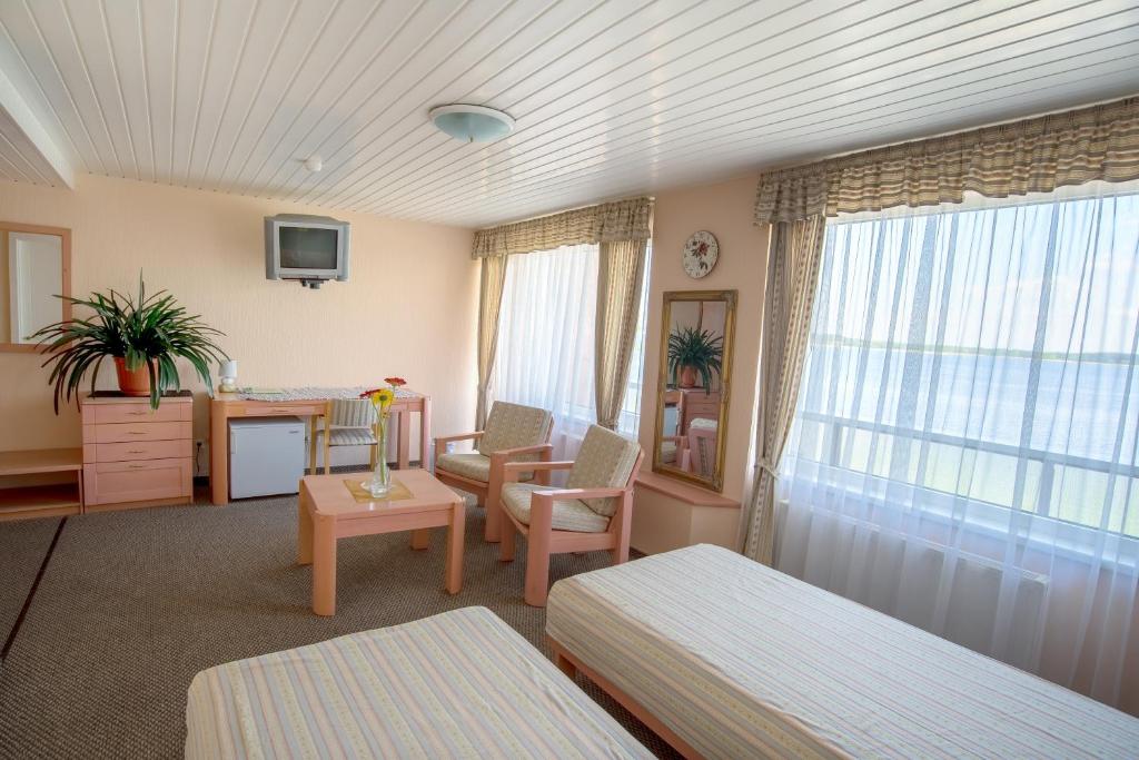 Postel nebo postele na pokoji v ubytování Hotel Mezaparks