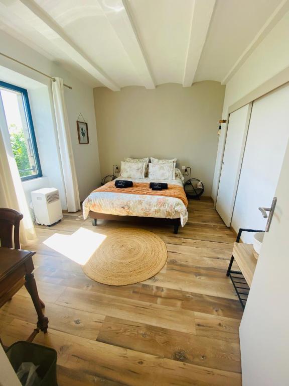 Postel nebo postele na pokoji v ubytování Le Mas Vivarés