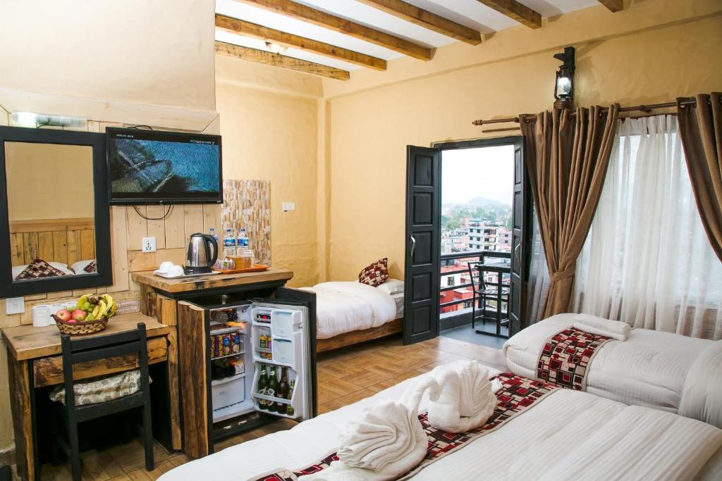 Una cama o camas en una habitación de Hotel Tourist Residency
