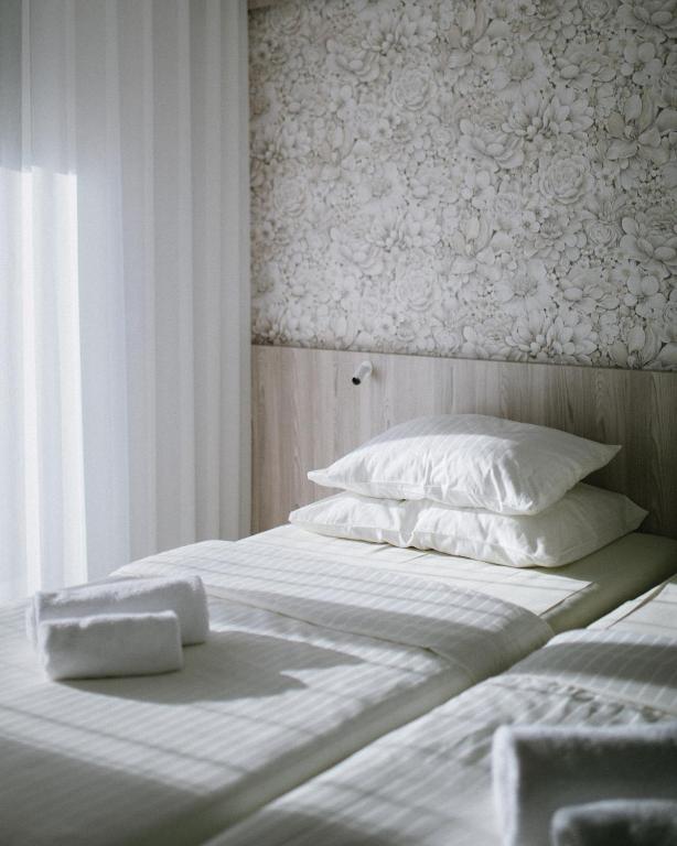 Postel nebo postele na pokoji v ubytování Hotel Capris Capodistria Boutique