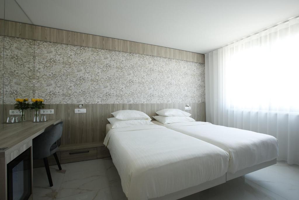 Postel nebo postele na pokoji v ubytování Hotel Capris Capodistria Boutique
