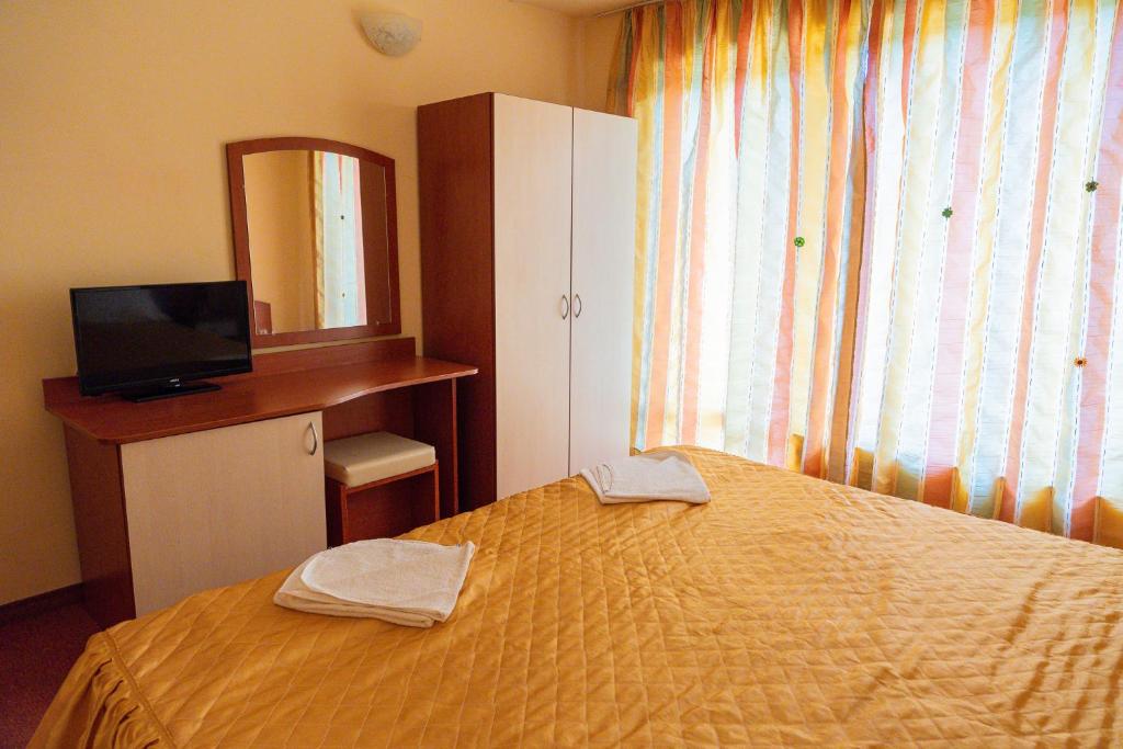Postel nebo postele na pokoji v ubytování Family Hotel Mimosa