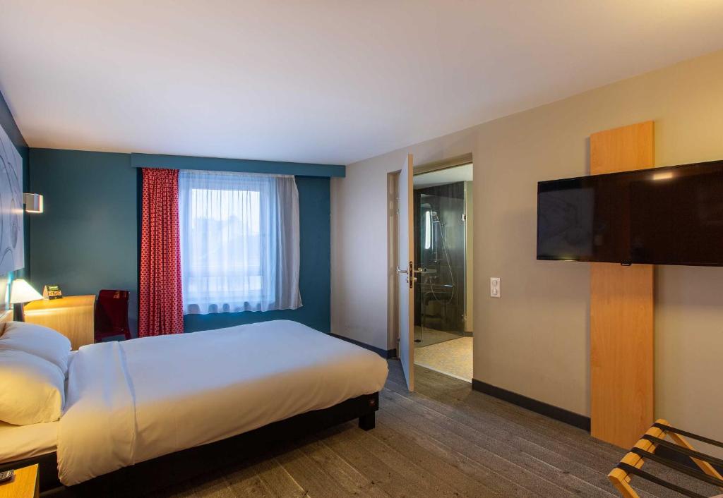 Postel nebo postele na pokoji v ubytování B&B HOTEL Orléans Centre Foch