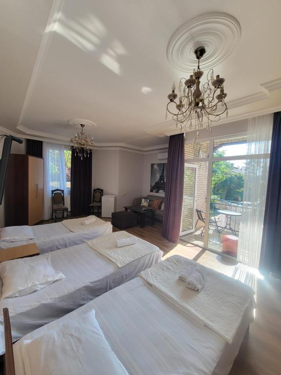 Postel nebo postele na pokoji v ubytování Guest House Deme