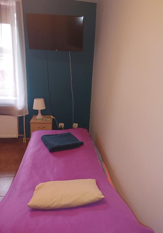 Postel nebo postele na pokoji v ubytování Hostel u Misiów