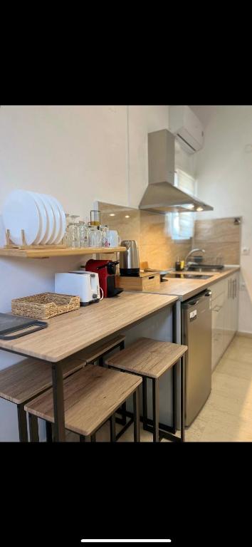 Kuchyň nebo kuchyňský kout v ubytování Yanna's Apartments