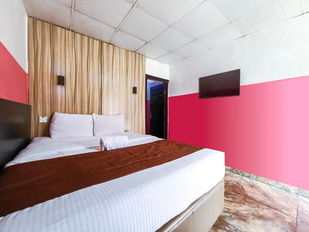 Postelja oz. postelje v sobi nastanitve Ivy Hotel Awolowo