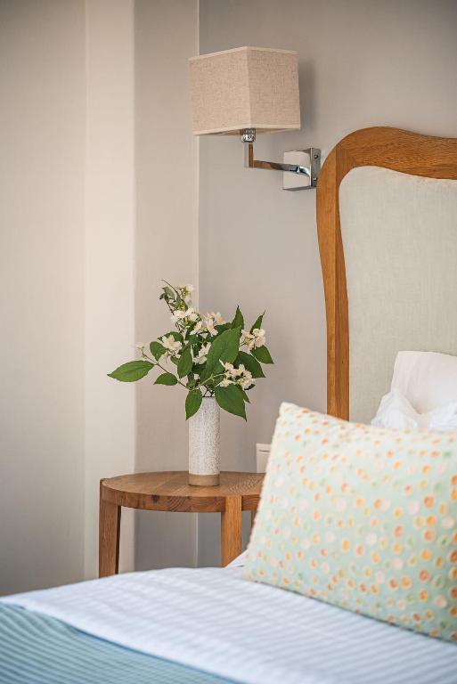 Postel nebo postele na pokoji v ubytování Ikion Eco Boutique Hotel