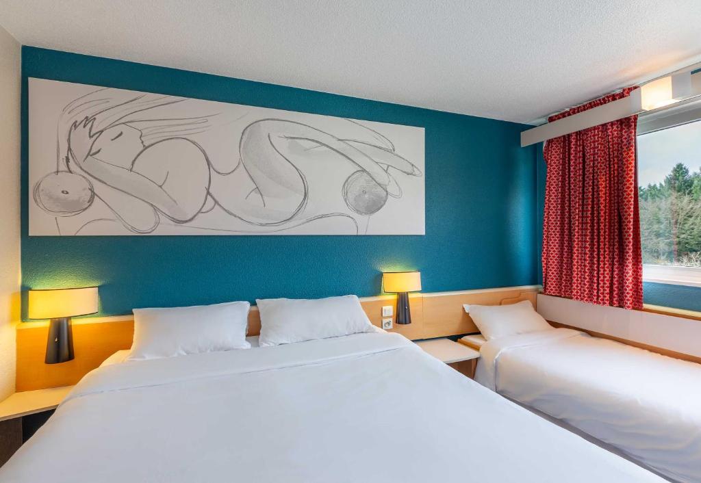 Postel nebo postele na pokoji v ubytování B&B HOTEL Orléans Nord Saran