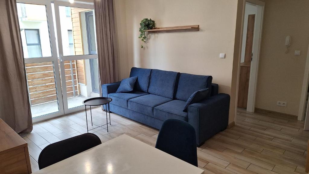 Posedenie v ubytovaní Apartament Dębowy z miejscem parkingowym