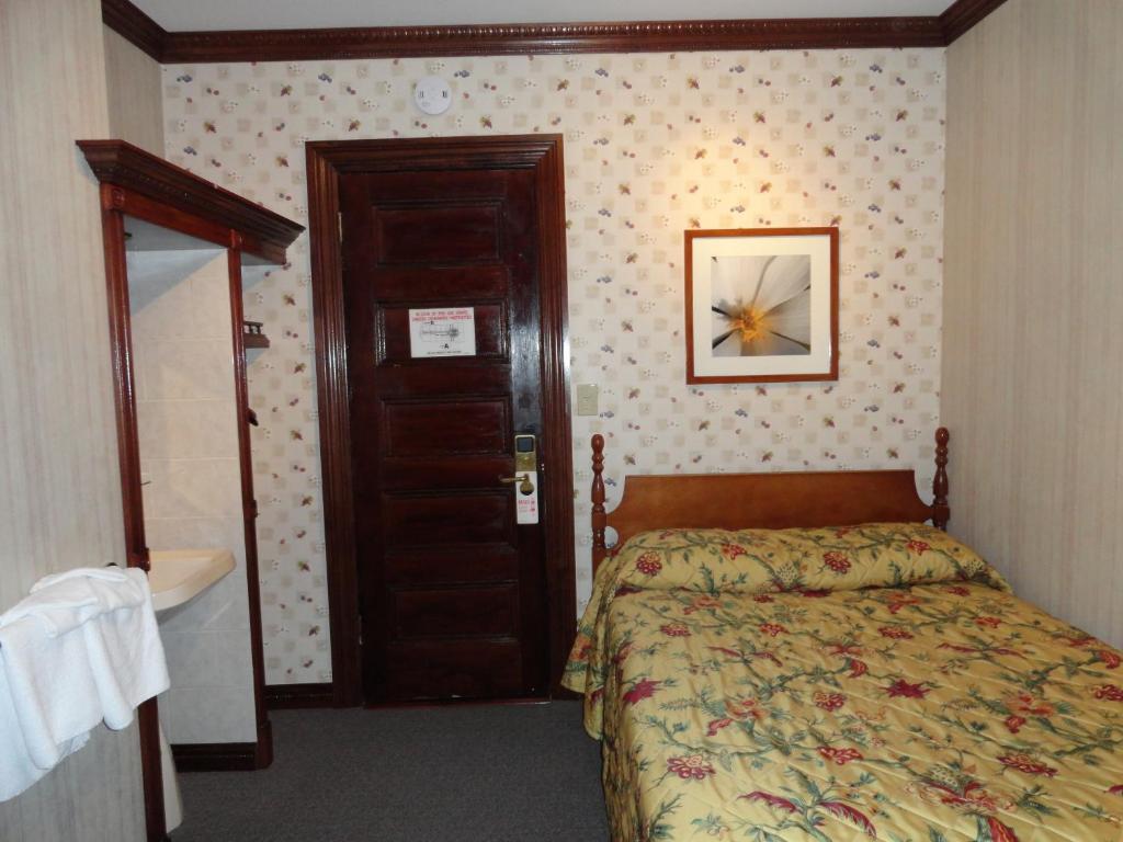 Postel nebo postele na pokoji v ubytování Hotel 31 Extended Stay