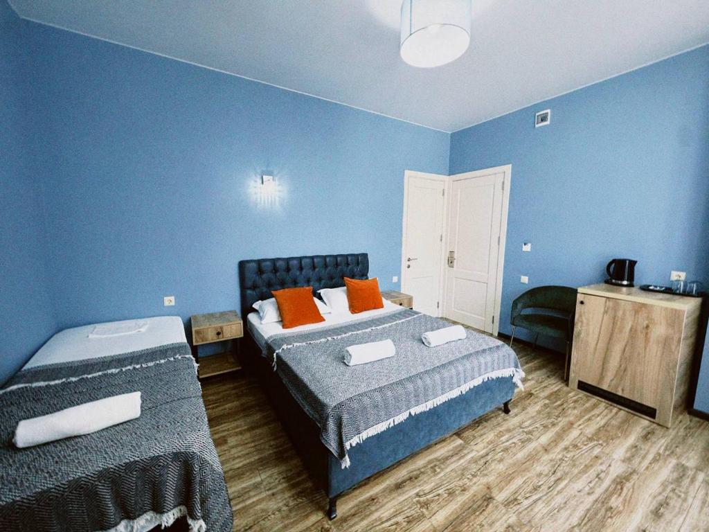 Postel nebo postele na pokoji v ubytování Aquamarinn