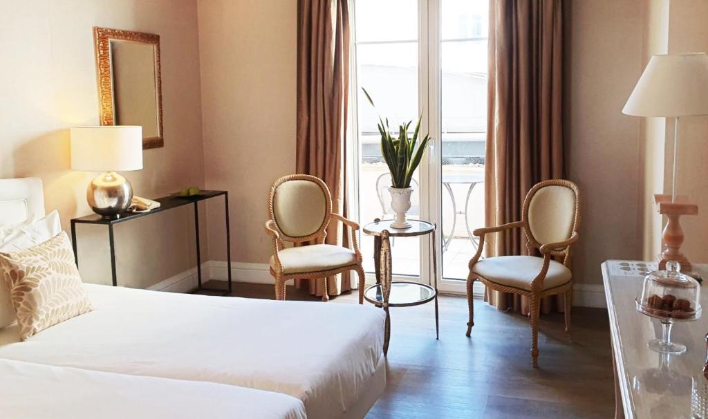 Postel nebo postele na pokoji v ubytování Grecotel Larissa Imperial