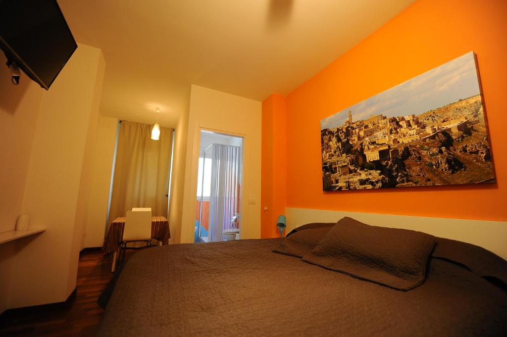 Letto o letti in una camera di amaranto bnb