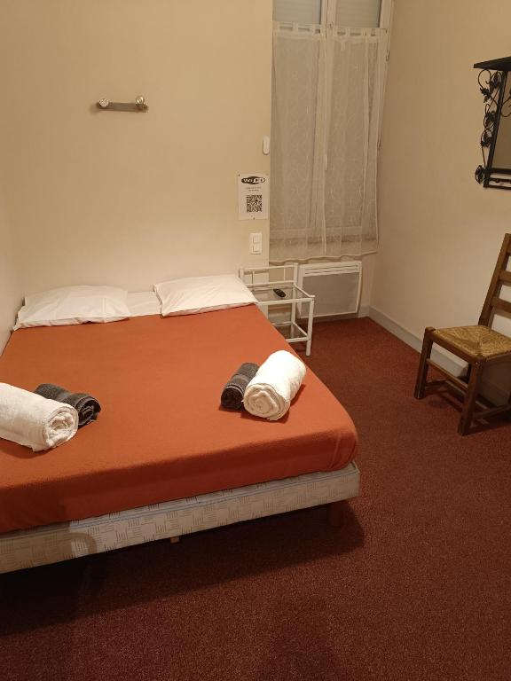 Postel nebo postele na pokoji v ubytování Le Terminus