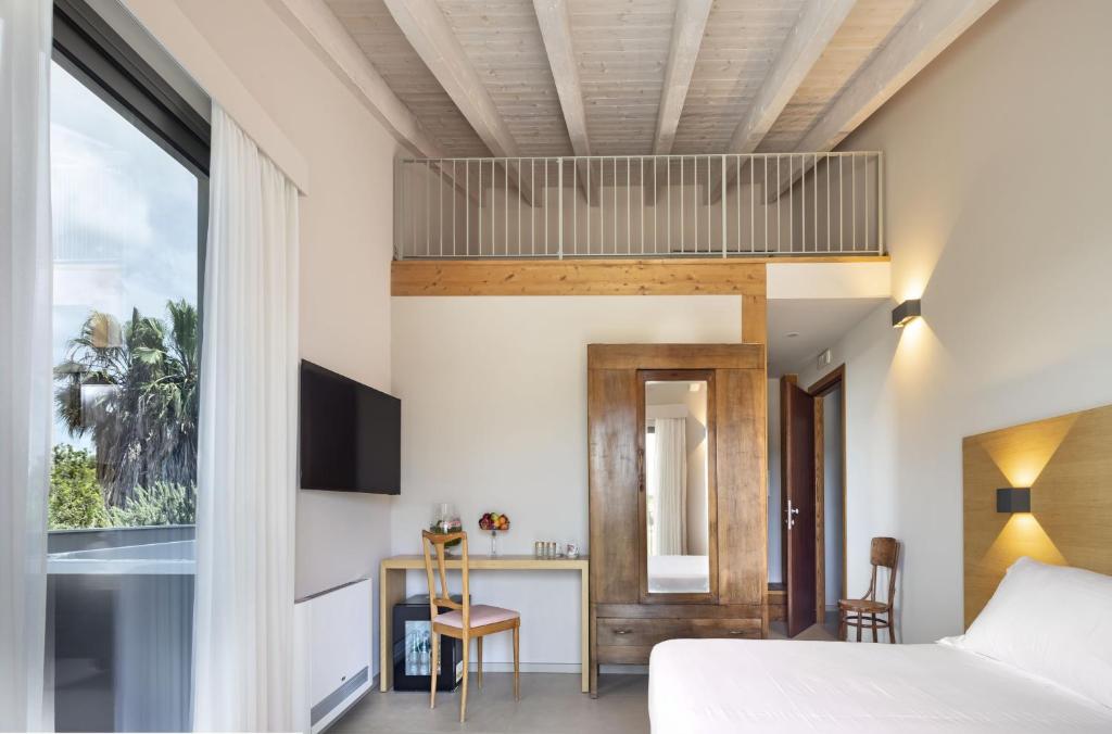 TV a/nebo společenská místnost v ubytování Ros'e Mari Green Home Hotel
