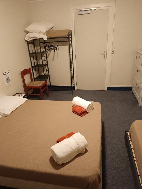Postel nebo postele na pokoji v ubytování Le Terminus