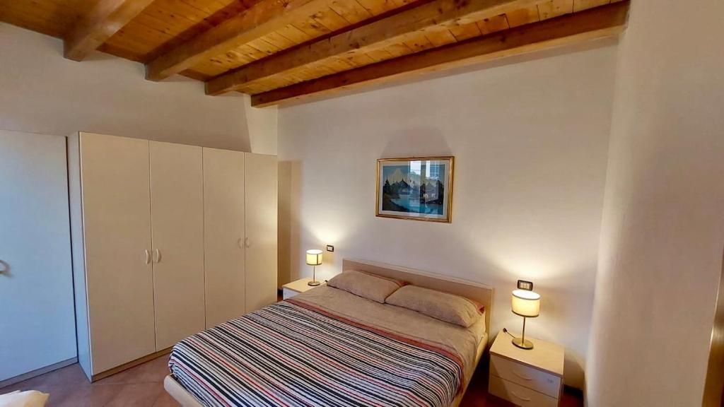 Ένα ή περισσότερα κρεβάτια σε δωμάτιο στο La casa nel Borgo 92