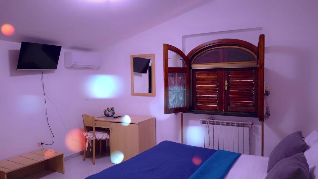 Postel nebo postele na pokoji v ubytování Hotel affittacamere novella