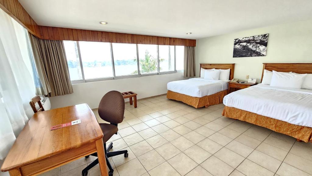 Postel nebo postele na pokoji v ubytování Best Western Riviera Tuxpan
