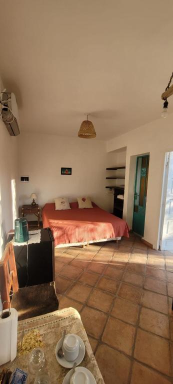 a bedroom with a bed in the middle of a room at El Churqui in Cafayate