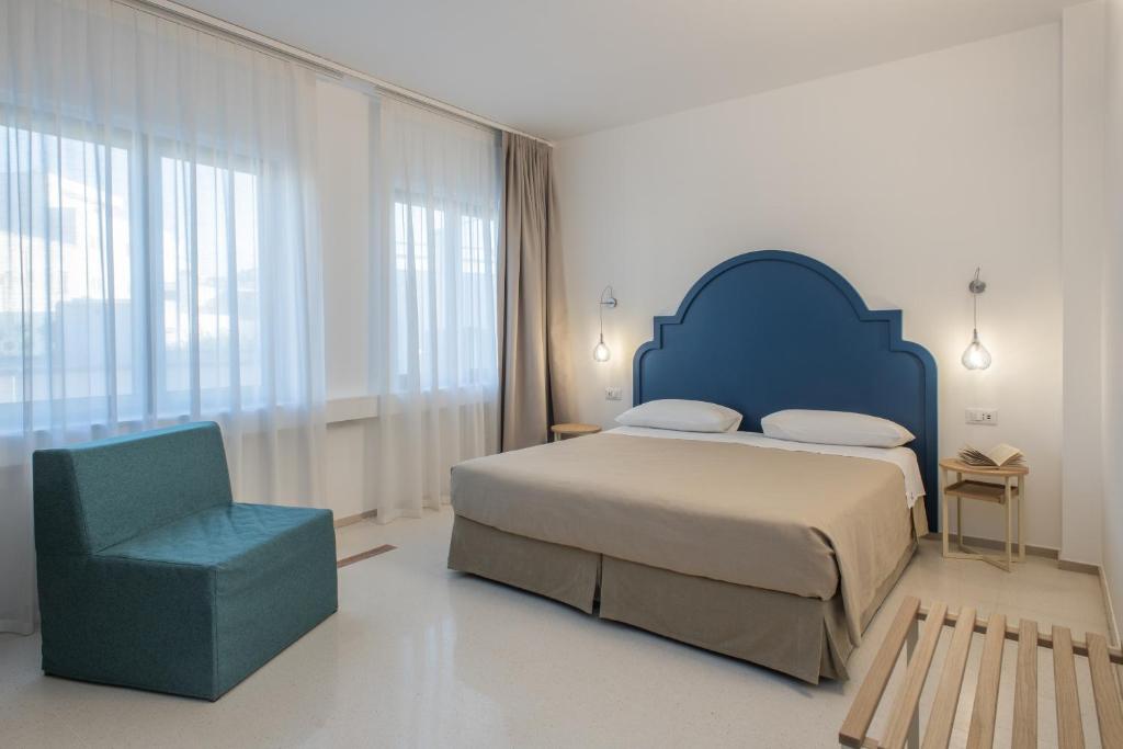 Postel nebo postele na pokoji v ubytování Hotel Albània