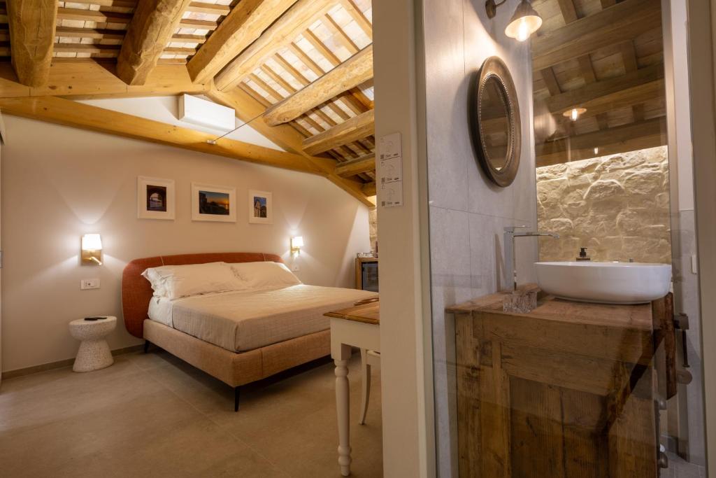 Postel nebo postele na pokoji v ubytování Palazzo Anelli - Rooms & Relax