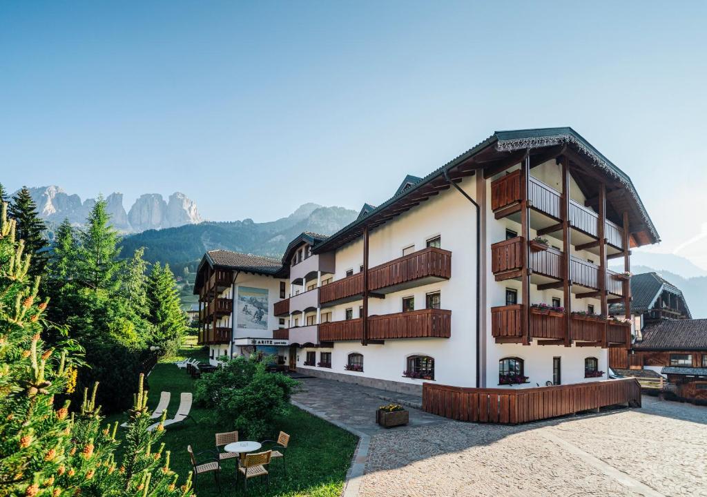 a large building with balconies on the side of it at Garni Aritz in Campitello di Fassa