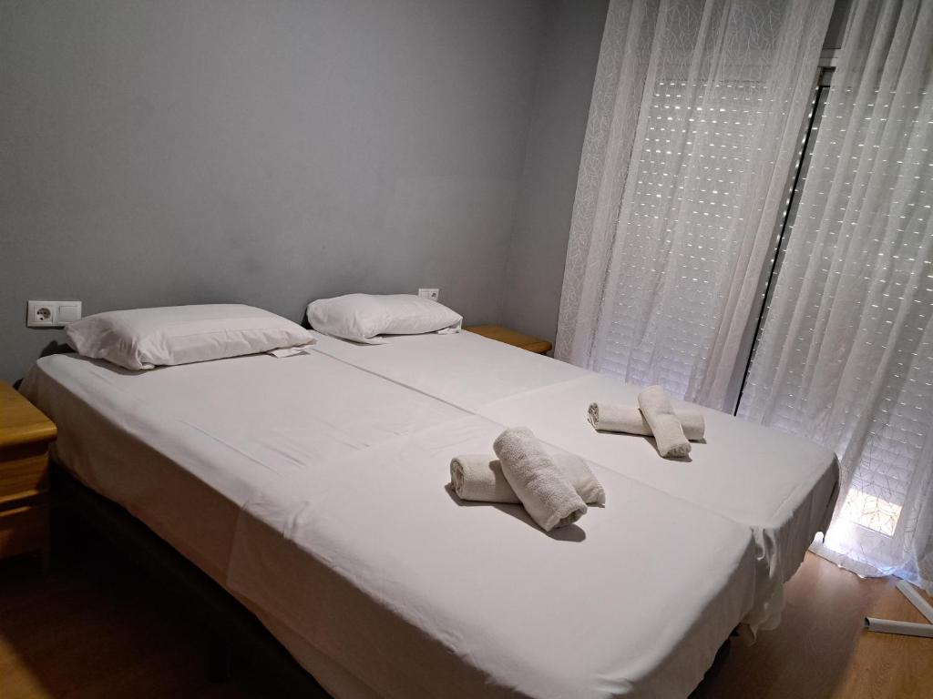 Posteľ alebo postele v izbe v ubytovaní Piso Acogedor Fortuny