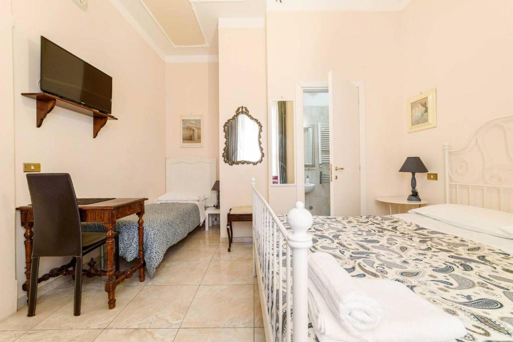 Postel nebo postele na pokoji v ubytování Borgo Antico Santa Lucia
