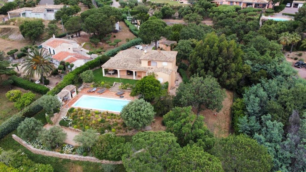 an aerial view of a house with a swimming pool at Vue mer - Grimaud, France in Port Grimaud