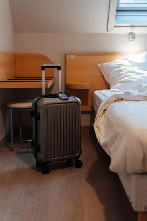 Postel nebo postele na pokoji v ubytování Hotel Brasserie De Beiaard