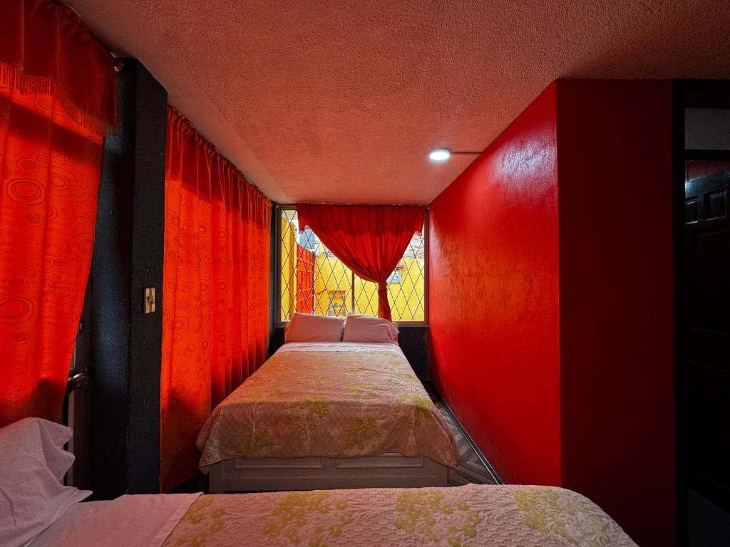 Postel nebo postele na pokoji v ubytování Hotel Jimmy Latacunga