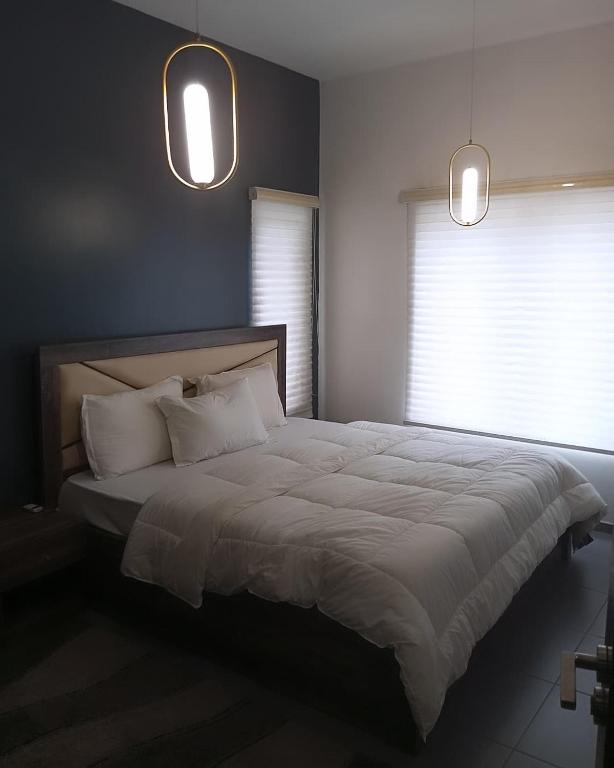 Postel nebo postele na pokoji v ubytování Enzo Apartments