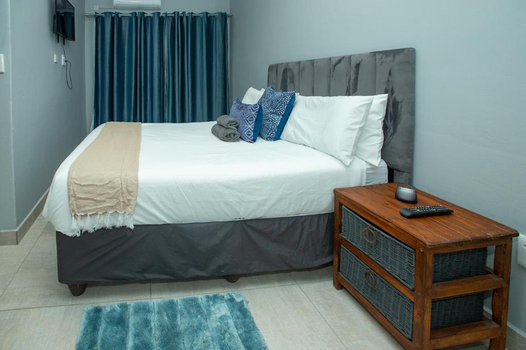 Postel nebo postele na pokoji v ubytování Stegor Suites
