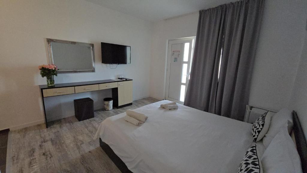 Postel nebo postele na pokoji v ubytování Anacris Guesthouse