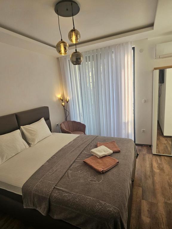 Postel nebo postele na pokoji v ubytování La Vida Apartments
