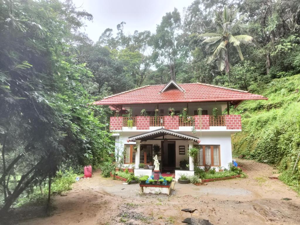 a house on the side of a hill at Reevilla in Madikeri