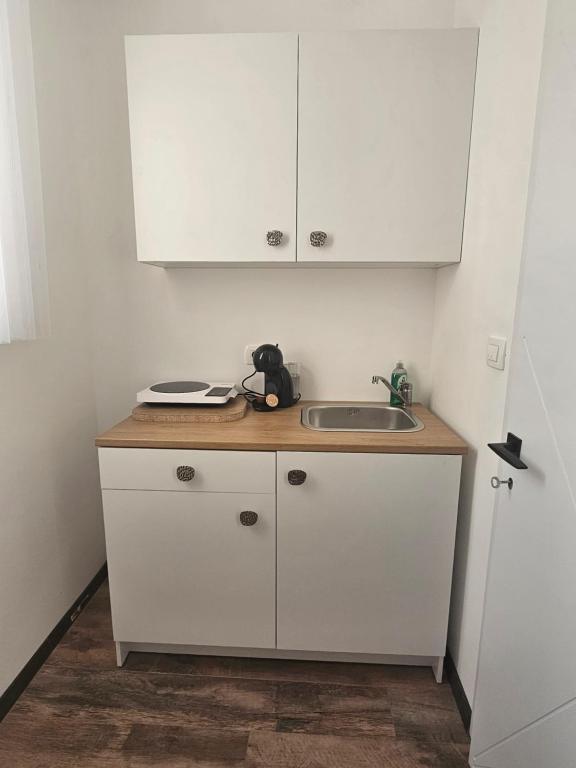 Kuchyň nebo kuchyňský kout v ubytování La Vida Apartments