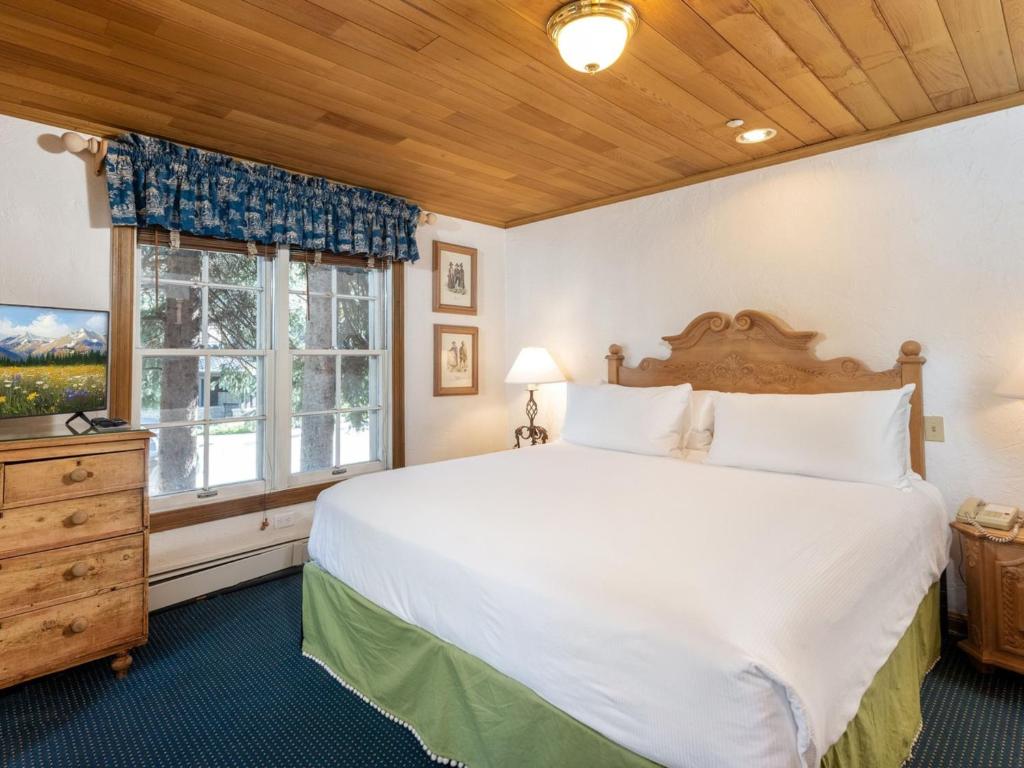 Postel nebo postele na pokoji v ubytování Christiania Lodge