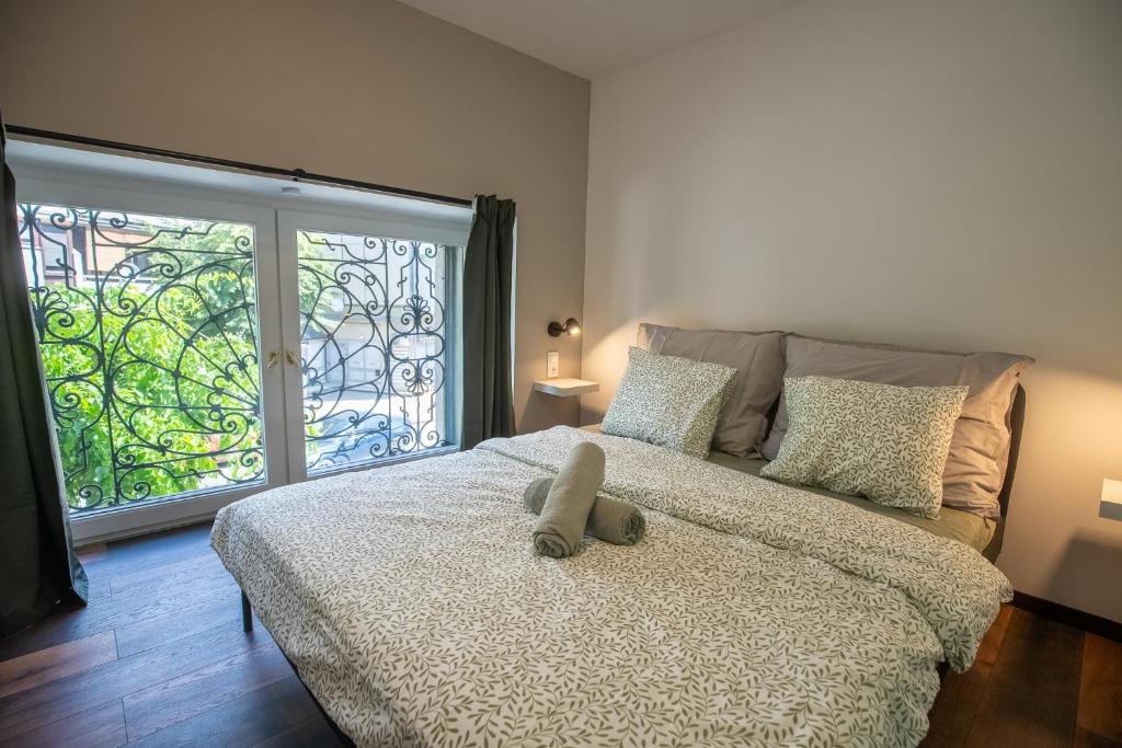 Postel nebo postele na pokoji v ubytování The Loft Esztergom