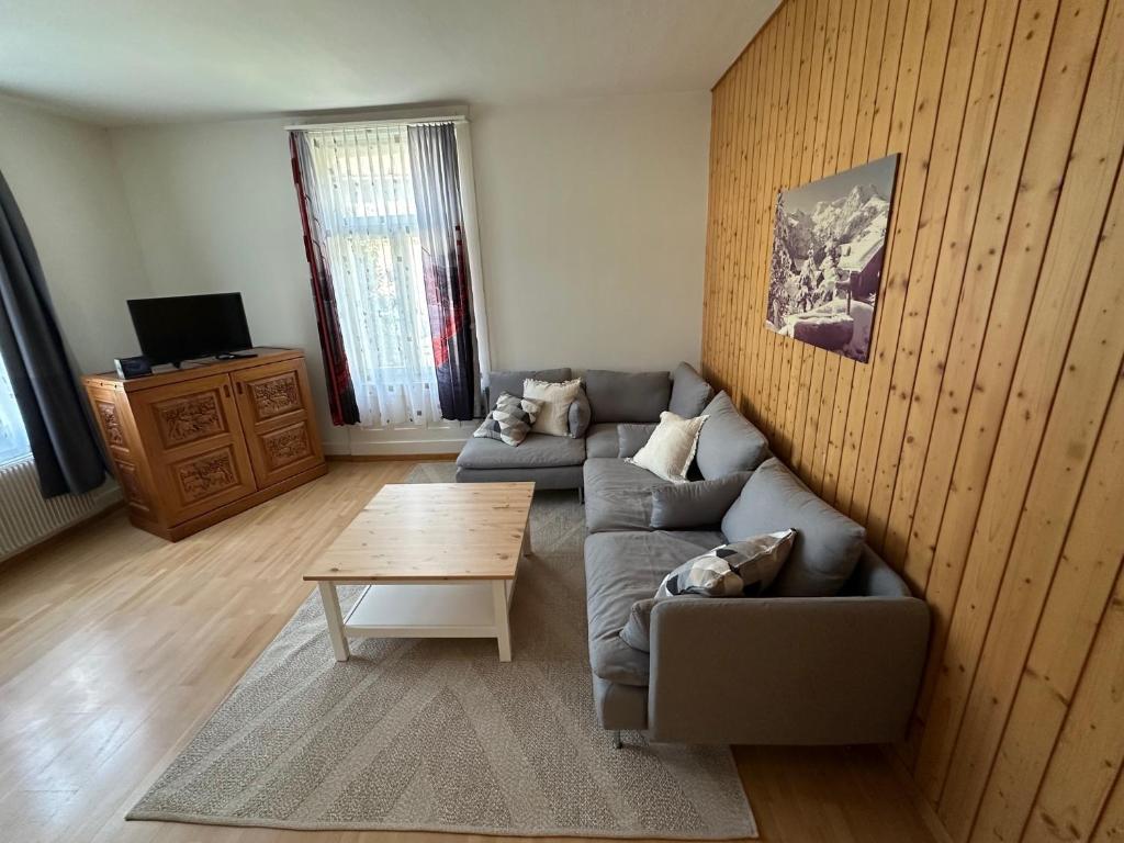 a living room with a couch and a coffee table at Harderblick in Interlaken