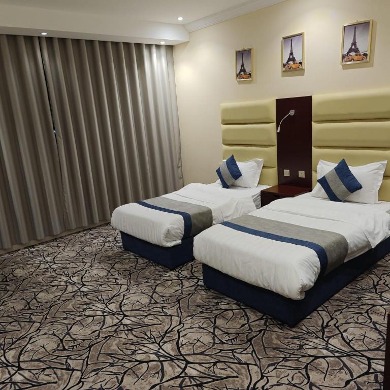 Postel nebo postele na pokoji v ubytování Borj Al Thahabiah ApartHotel