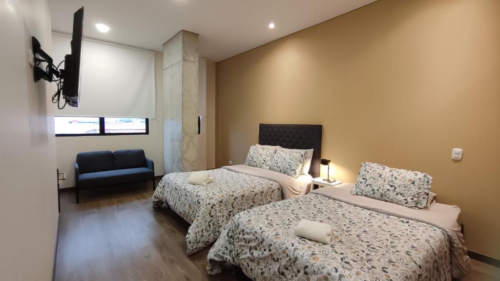 Postel nebo postele na pokoji v ubytování La Milla, Lofts