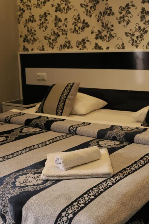 Postel nebo postele na pokoji v ubytování AVAGYAN'S Hotel-restaurant